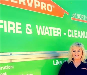 Picture of  Suzanne in front of SERVPRO van